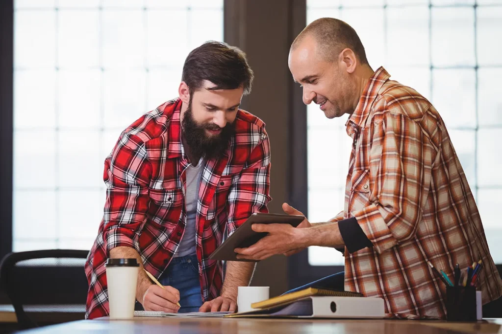men working together in casual environment