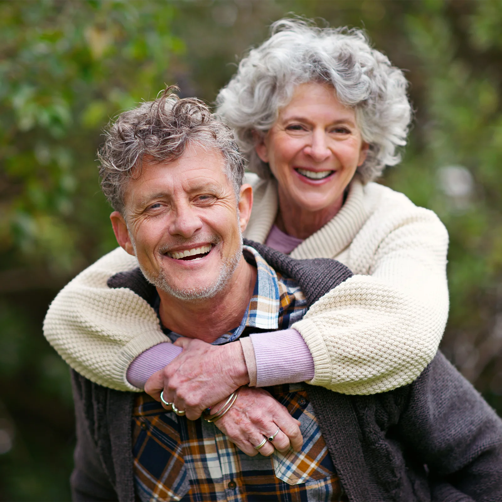 smiling older couple enjoying the outdoors