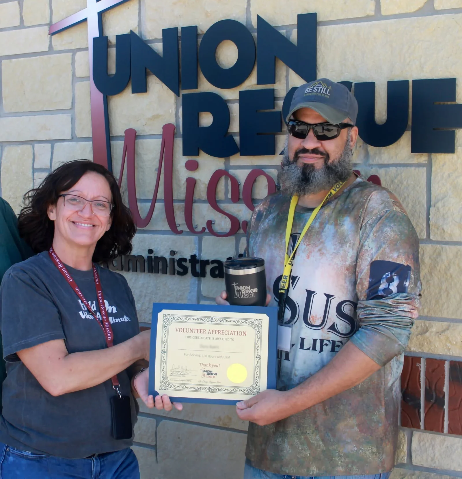 urm volunteer being recognized for his commitment