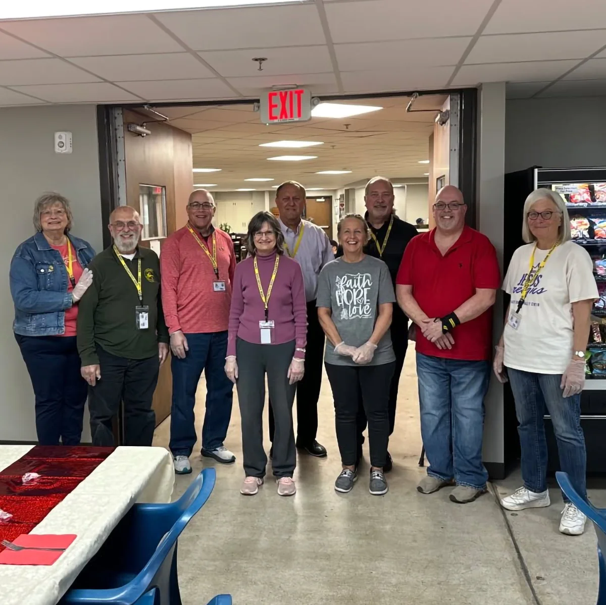 volunteer group helping set up for dinner at urm